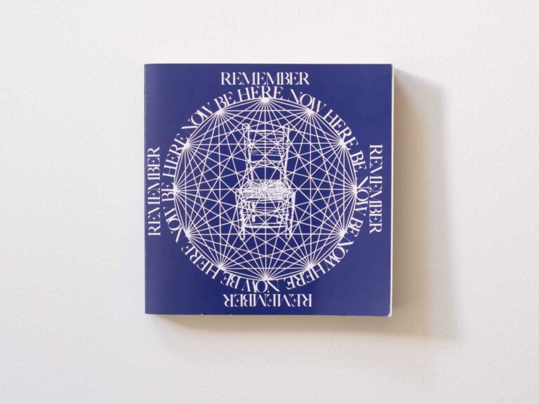 The book, Be Here Now, on a white background.