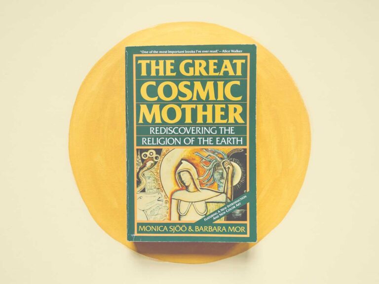 The book, The Great Cosmic Mother, centered on a yellow background.